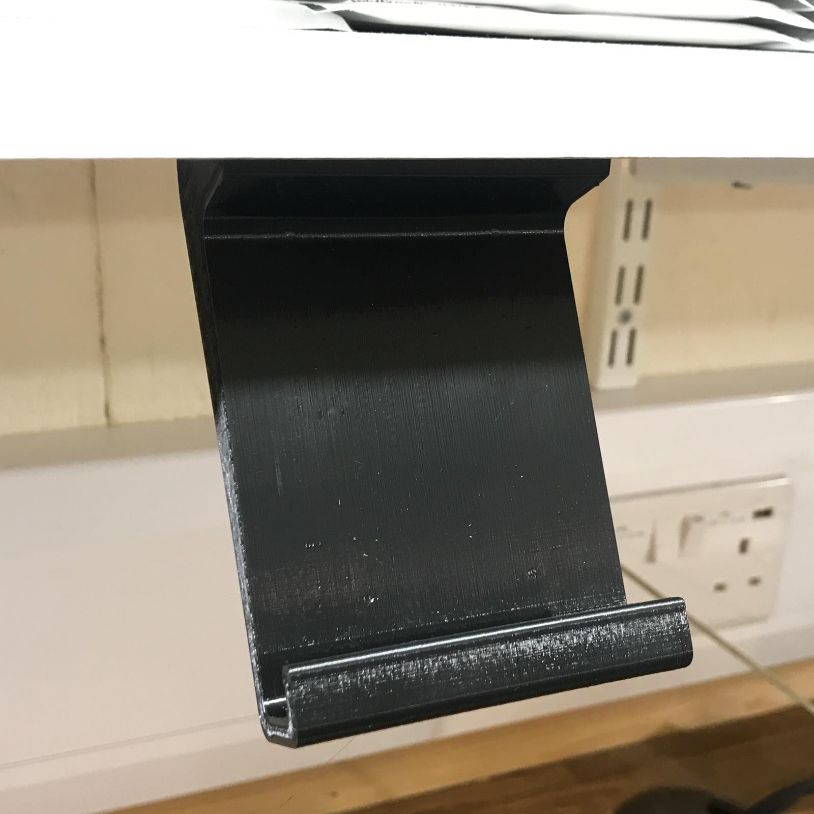 Under Shelf or Cabinet Mobile Phone Horizontal Phone Display in Black with Fixings Service Item Wayward Media 902814